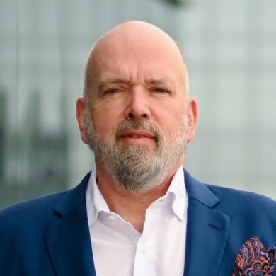 A person in a blue suit

Description automatically generated